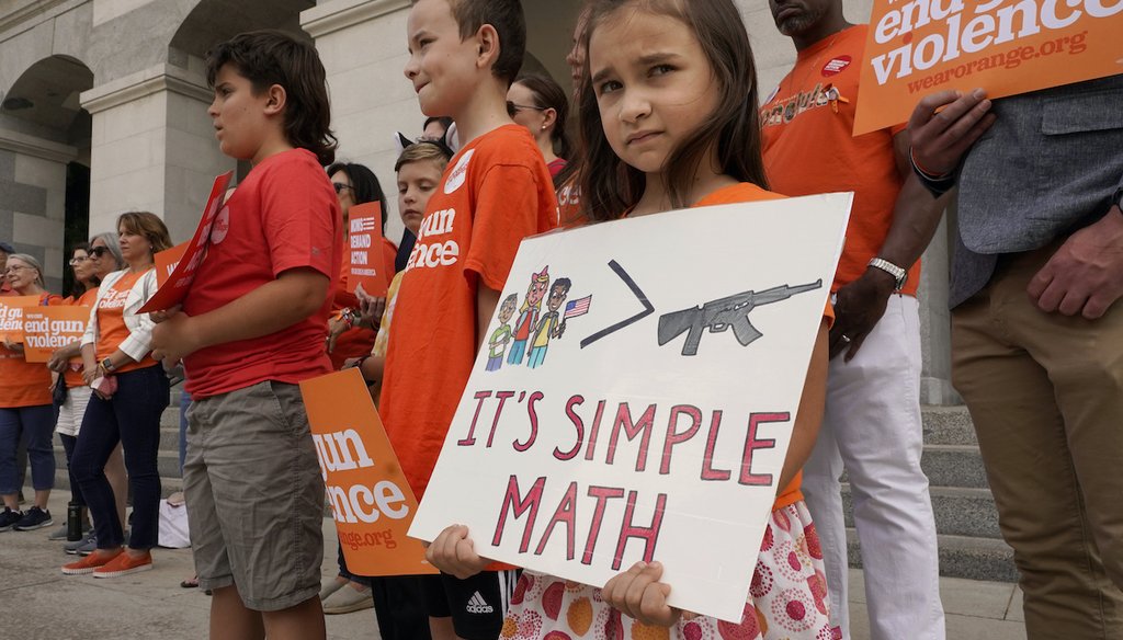Elise Schering, 7, displays a message during a National Gun Violence Awareness rally at the Capitol in Sacramento, Calif., June 2, 2022. Gov. Gavin Newsom announced that California is spending $11 million to promote use of red flag laws. (AP)
