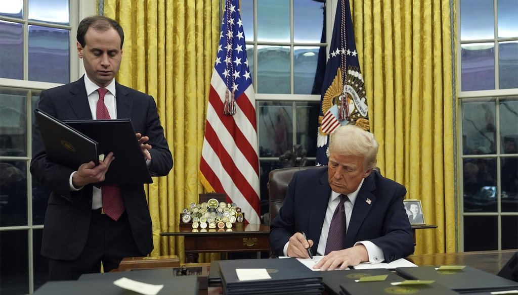 President Donald Trump signs an executive order regarding the southern border in the Oval Office of the White House, Jan. 20, 2025, in Washington. (AP)